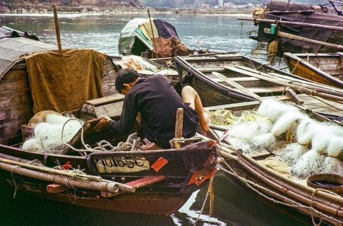 Man working on his sampan boat, Castle Peak, New Territories, Hong Kong, Asia, 1964