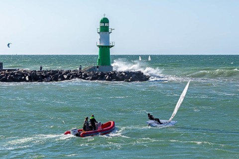 Waves, spray, people, boats, beacon, Warnow estuary, Warnemünde, Rostock, Mecklenburg-Western