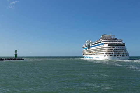 Cruise ship AIDA nova leaving, lighthouse, Warnow estuary, Warnemünde, Rostock, Mecklenburg-Western