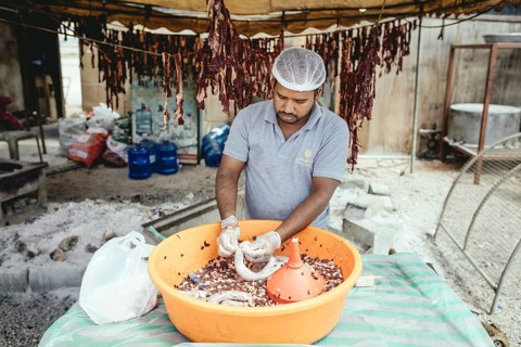 Traditional camel restaurant in Salalah, stuffing camel sausages, Dhofar, Oman