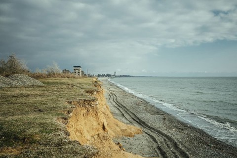 Beach and view of the city. The higher building is the 16-florr-building, as locals call it.