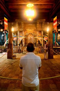 Pilgrims praying in front of the Holy Shrine, Temple of the sacred Tooth Relic or Sri Dalada