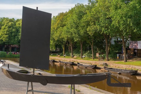 Historic peat harbour with peat barge, mooring, peat as heating material, transport from nearby