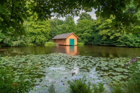 Boathouse at Meiereisee in Bürgerpark from 1866, landscape park with rivers and lakes, garden