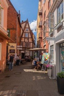 Small square in Wüstestätte alley, renovated Schnoor district with small shops, galleries,