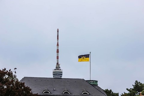 State flag of Baden-Württemberg on the Villa Reitzenstein, official residence of the Minister