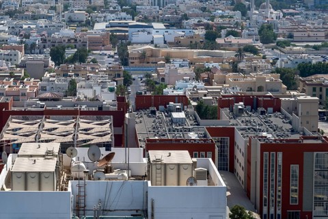 Rooftops with satellites and air conditioning systems, Abu Dhabi, United Arab Emirates