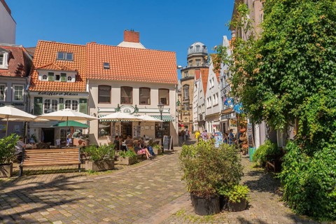 Renovated Schnoor district with small shops, square, skipper's house, flower pots, wall greenery,