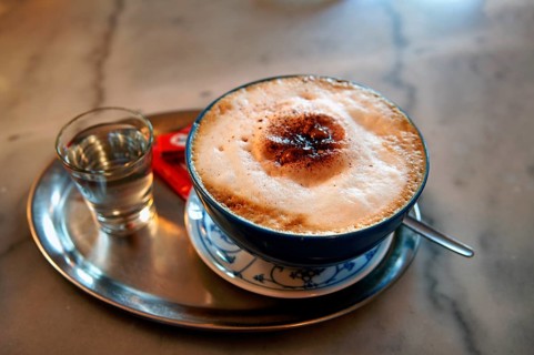 Cappuccino with a glass of water on a silver tray, Erlangen, Middle Franconia, Bavaria, Germany