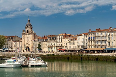 Harbour, Porte de la Grosse Horloge clock tower and the old town in La Rochelle, France