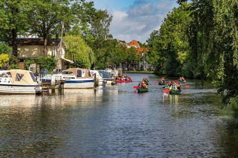 Canoes on the Trave in the Hanseatic city of LÃ¼beck, Schleswig-Holstein, Germany