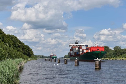 Container ships in a siding, siding area in the Kiel Canal, Kiel Canal, Kiel Canal,