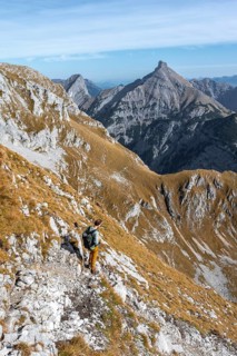 Mountain panorama with picturesque mountain landscape, mountaineers descending from the Gamsjoch,