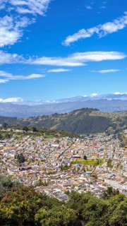 Skyline panoramic view of historic center in Quito, Ecuador from lookout of Virgin of Panecillo