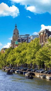 Holland, Amsterdam canals with scenic bridges and historic city center, UNESCO World Heritage site