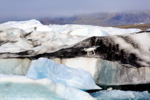 Camera drone flies over icebergs, JökulsÃ¡rlÃ³n glacier lagoon, Jökulsarlon, glacial lake,
