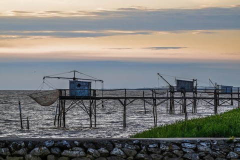 Sunset over Fishing huts over Randonnee entre Histoire et Nature, Fouras, Fouras-les-Bains,