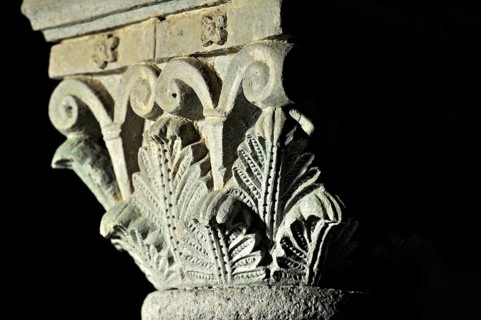 Column capitals with plants, flora, relief in stone, underground grove of columns, pagan crypt,