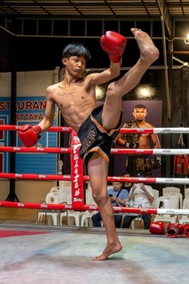 Thai boxing Muai Thai boxer in action, Pattaya, Thailand