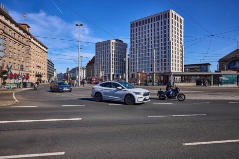 Traffic area, modern architecture, general building development, overhead lines, vehicles, cars,