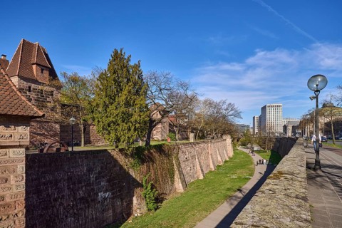 Old town, city fortification, city wall, tower, modern architecture, lantern, trees, lawn, blue