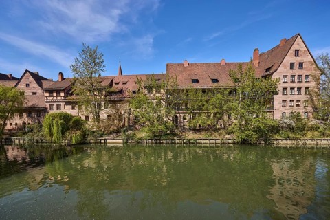 River Pegnitz, historical buildings, houses, trees, reflections, water surface, blue sky,