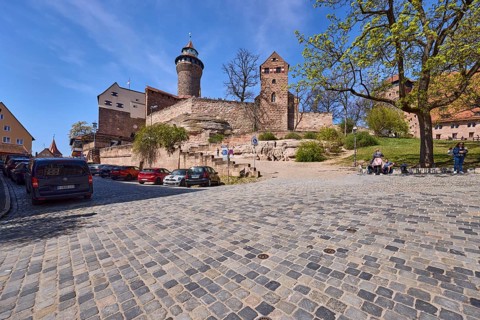Kaiserburg, castle, castle chapel, round tower, trees, lawn, parking boxes, parking lane, vehicles,