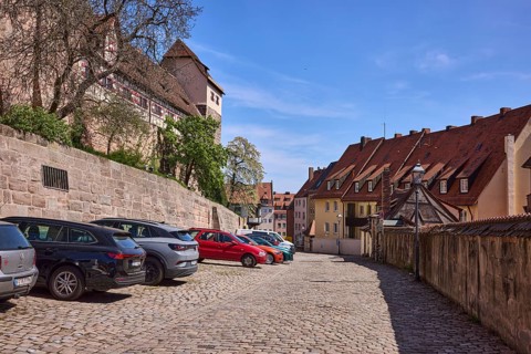 Old town, street, cobblestone pavement, residential building, castle, lantern, parking boxes,