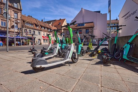 E-scooter in the city, problem, traffic problem, general architecture, pavement, pavement slabs,