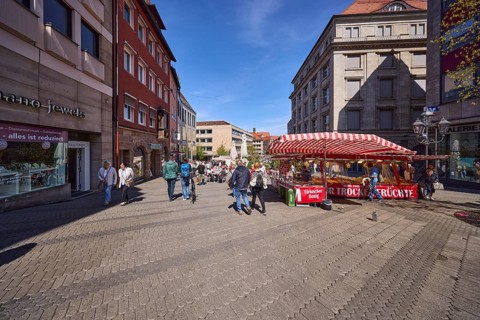 Pedestrian zone, retail shops, market, market stalls, general architecture, pedestrians as