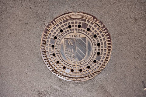 Manhole cover, city coat of arms, drainage, asphalt, road, Nuremberg, Middle Franconia, independent