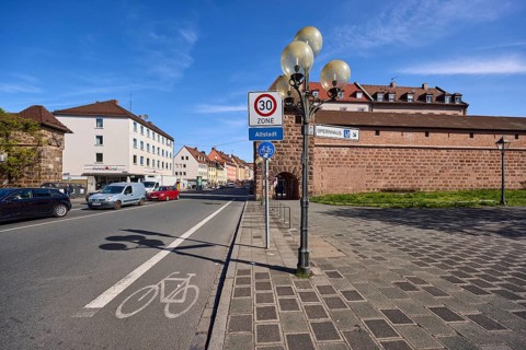 City fortification, city wall, zone 30 sign, additional sign old town, lantern, road marking cycle