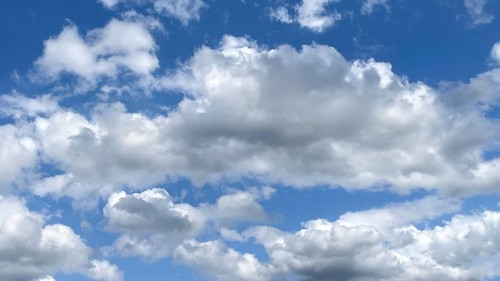 White clouds Altocumulus in front of blue sky. international
