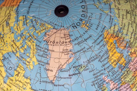 Puzzle globe. Map made from puzzle pieces. Greenland and Denmark