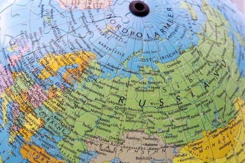 Puzzle globe. Map made from puzzle pieces. Russia and North Pole