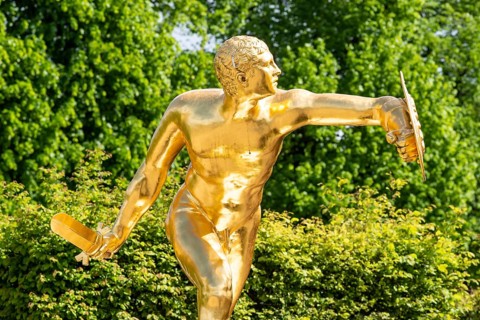 Golden sculpture, warrior with shield and sword, Herrenhausen Gardens, Baroque garden at castle