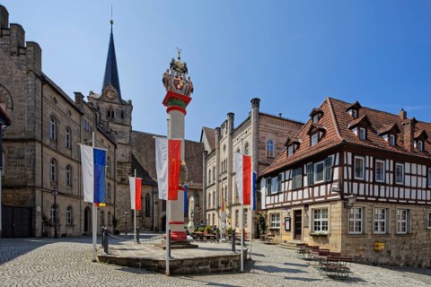 From left Catholic parish centre St. Johannes Catholic church St. Johannes 14th century, column of