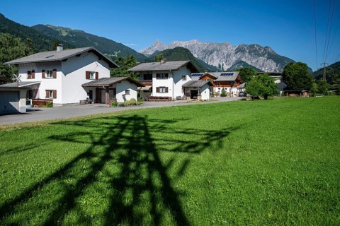 Shadow image of electricity pylons and residential neighbourhood, Schruns, Vorarlberg, Austria