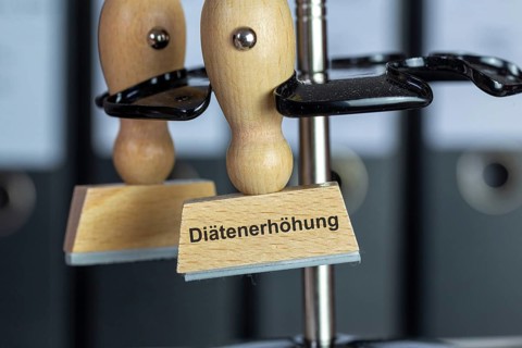 Stamp with added text DIET INCREASE on a desk (symbolic image)