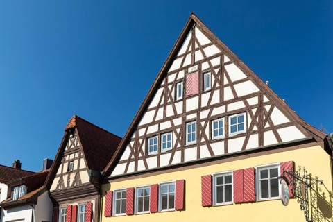 Historic houses with half-timbered gables and shutters in the old town centre of Bad Windsheim,