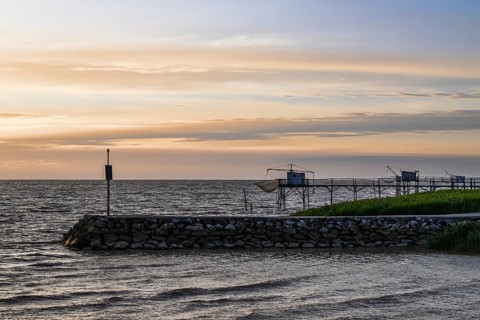 Sunset over Fishing huts over Randonnee entre Histoire et Nature, Fouras, Fouras-les-Bains,
