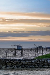 Sunset over Fishing huts over Randonnee entre Histoire et Nature, Fouras, Fouras-les-Bains,
