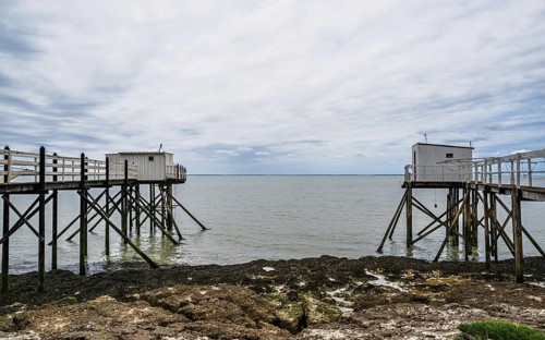 Fishing huts over Randonnee entre Histoire et Nature from a drone, Fouras, Fouras-les-Bains,