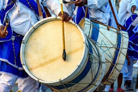 Musicians with their rustic wooden drums and colorful clothes during the religious festival of