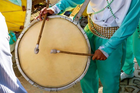 Musicians with their drums and colorful clothes at the typical religious festival of Congado in a