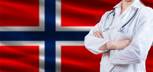 Doctor with crossed arms on Norway flag. Norway health and care concept. Female doctor on Norway