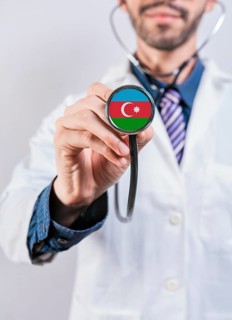 Azerbaijan health and medical insurance concept. Azerbaijan healthcare system, doctor holding