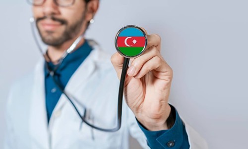 Doctor holding stethoscope with Azerbaijan flag. Azerbaijan health and care concept, Azerbaijan