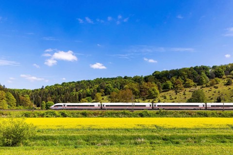 InterCityExpress ICE en route on the Swabian Alb near Lonsee. Landscape on the railway's