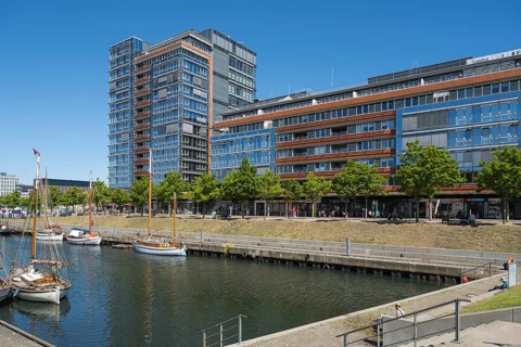 Modern office building and sailing boats at Germaniahafen, museum harbour, Kiel, Kiel Fjord, Baltic